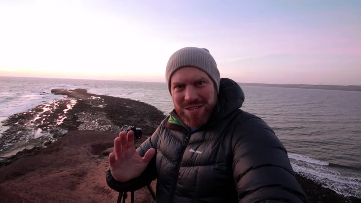 Photographer working with a higher vantage point rather than preferred beach position