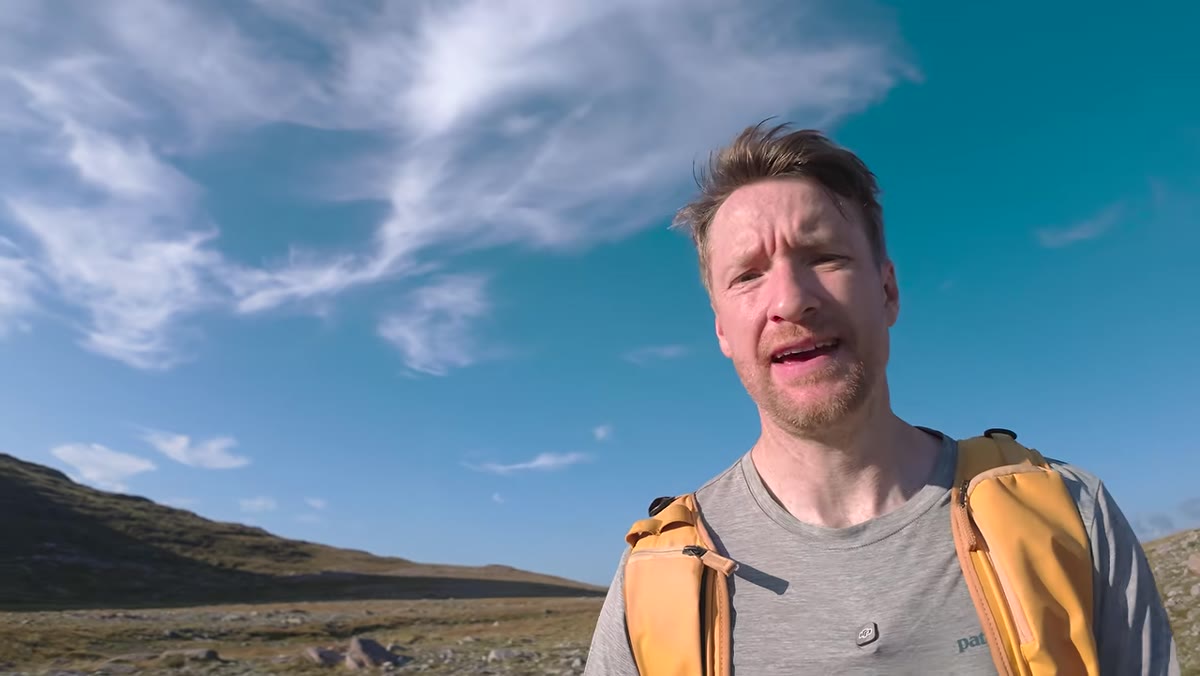 Heaton on the hillside explaining the two peaks and route options