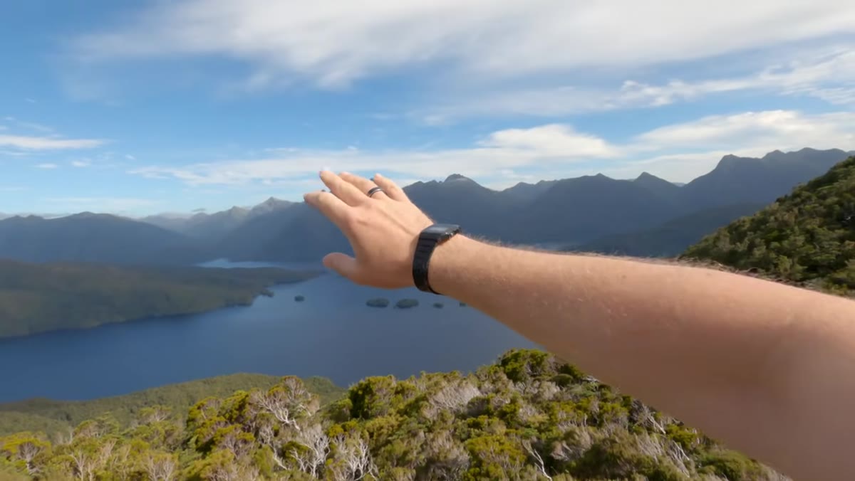 Wide establishing shot looking over Dusky Sound with peaks visible