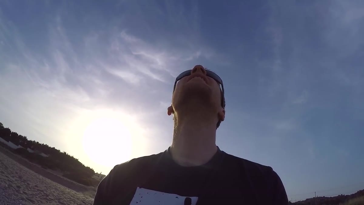 Drone camera pointing straight down over beach sunloungers