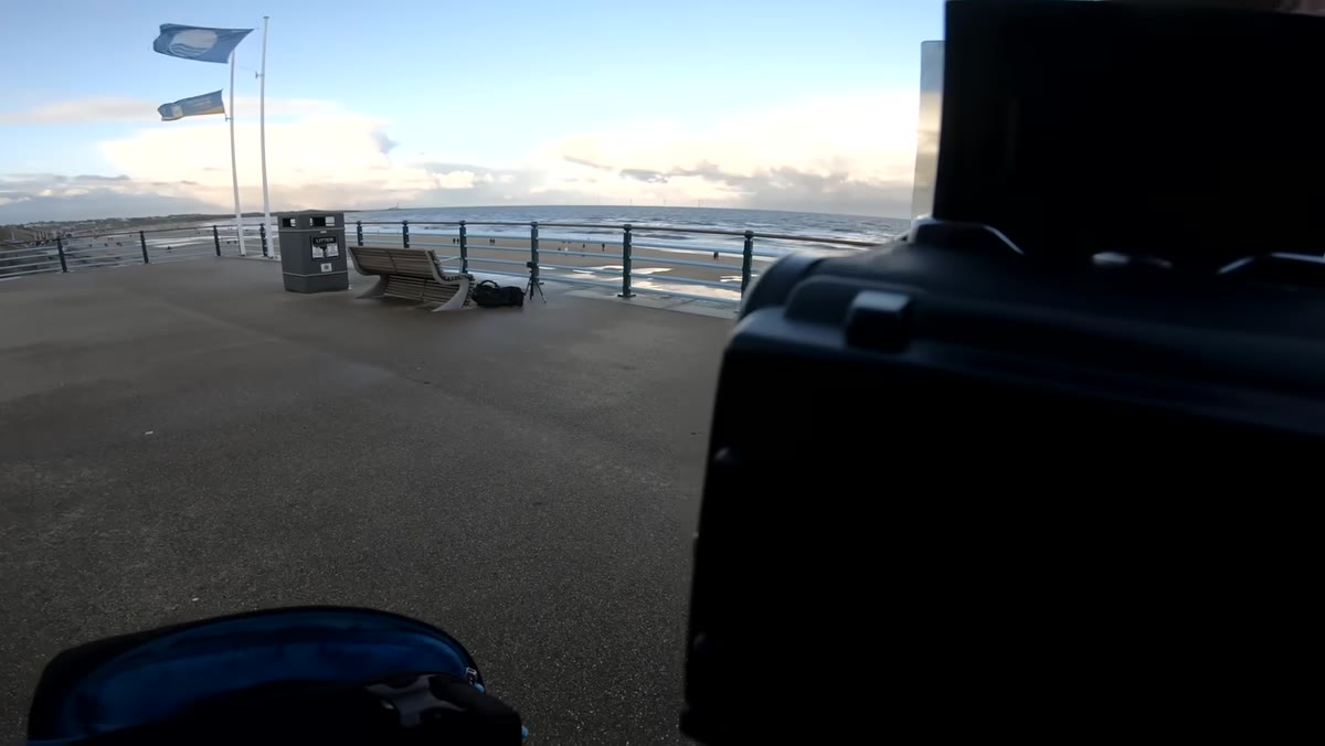 Two-stop soft-edge graduated filter being placed in front of the lens