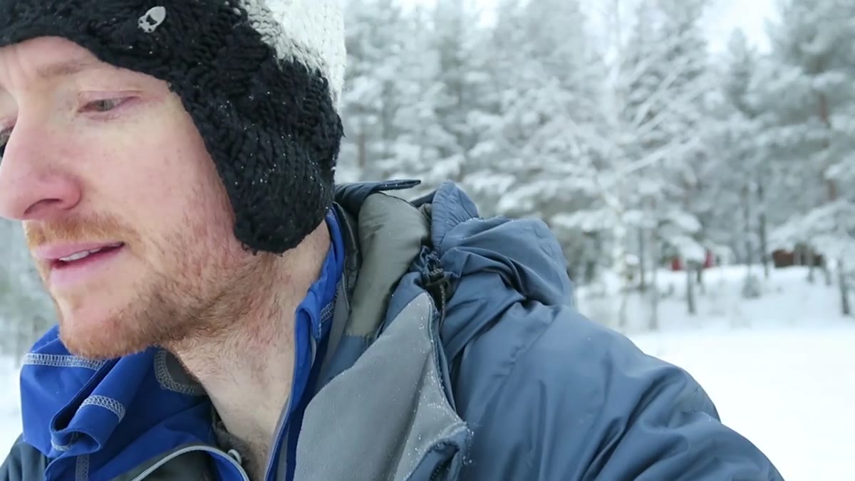 Camera display showing 55mm f/10 settings on frozen lake