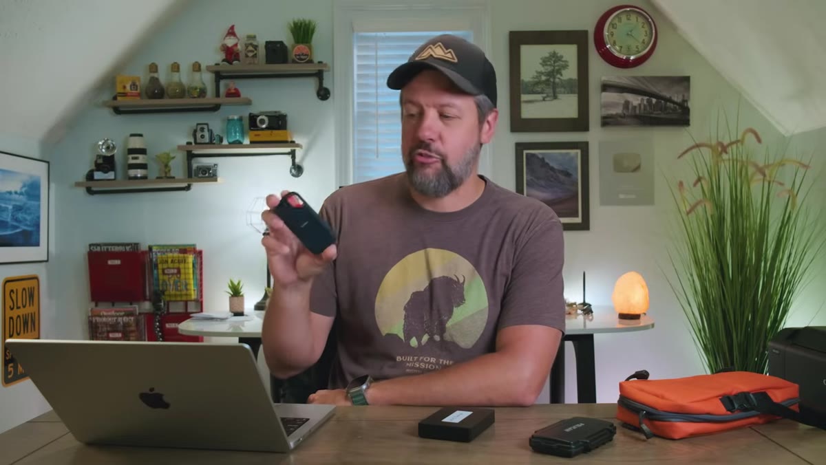 caption: SanDisk rugged portable drive shown next to laptop