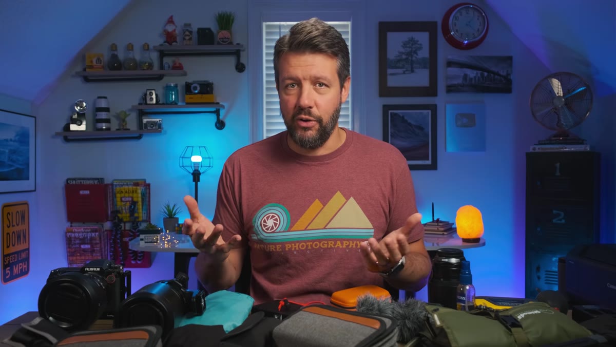 Two lenses: 23mm prime and 100-200mm on the desk