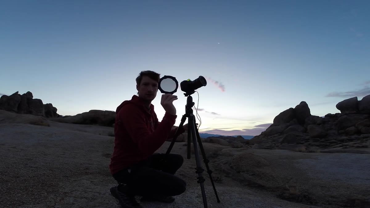 Heaton adjusting a polarizing filter on his lens