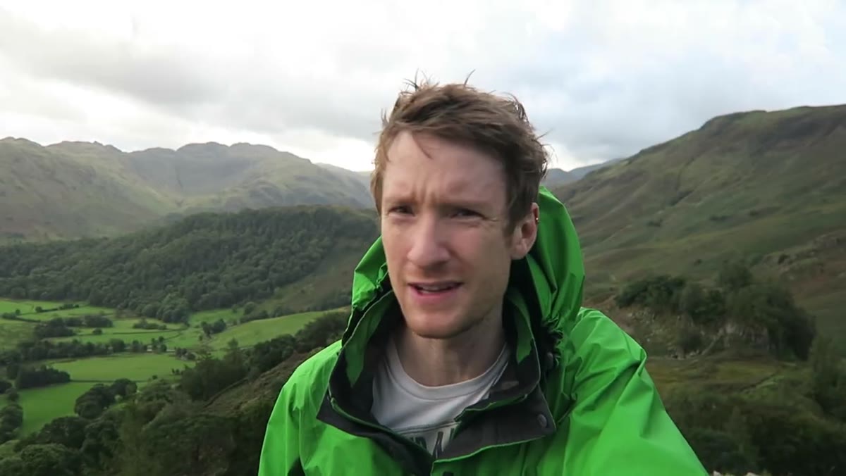 Thomas and Simon arriving at Castle Crag summit in rain