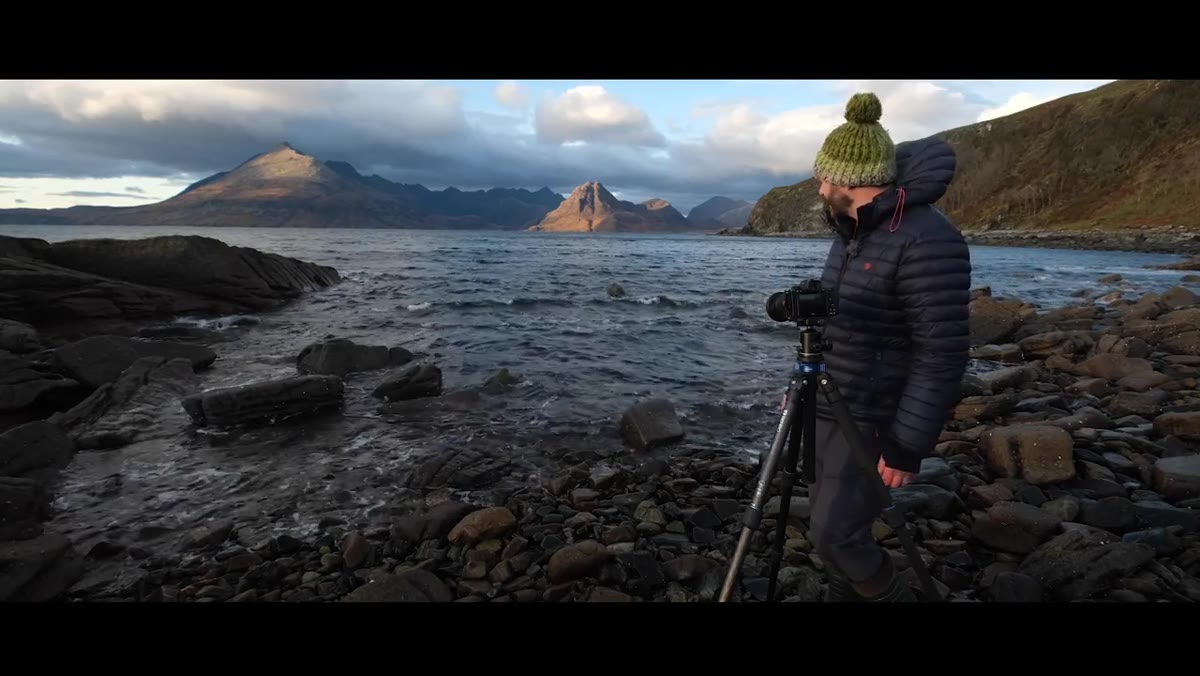 Nigel standing at the coast watching the ocean at dawn