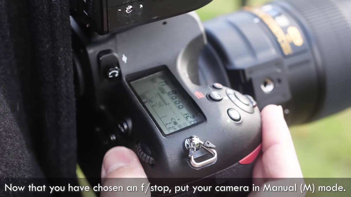 Camera settings showing manual mode and low ISO value