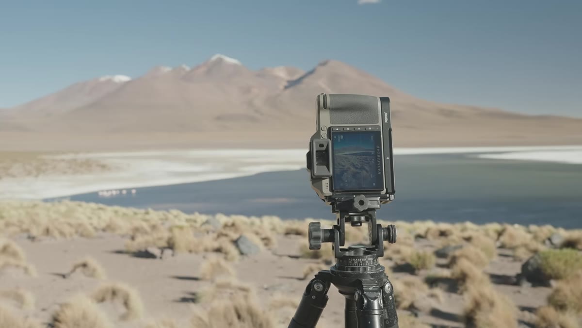 Heaton standing at Laguna Cañapa scanning for composition