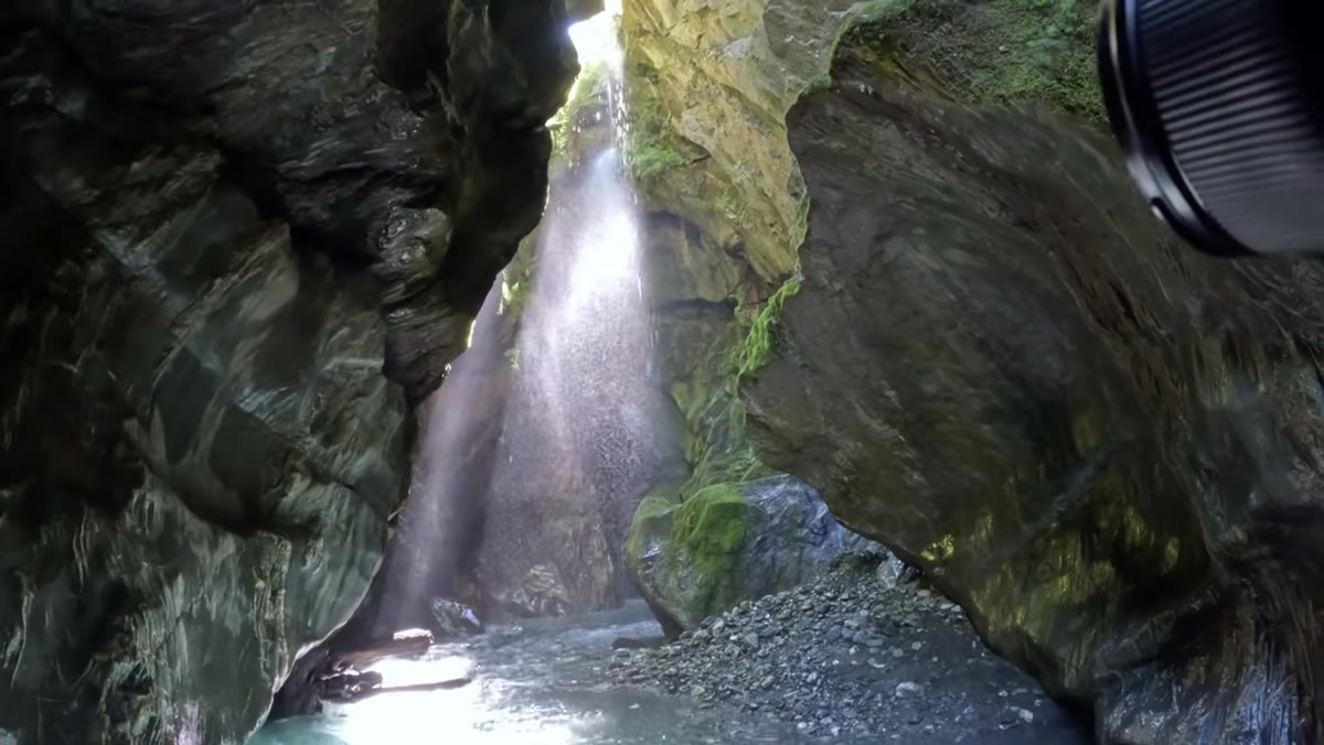 Wide shot of waterfall scene showing edges and distracting elements in frame