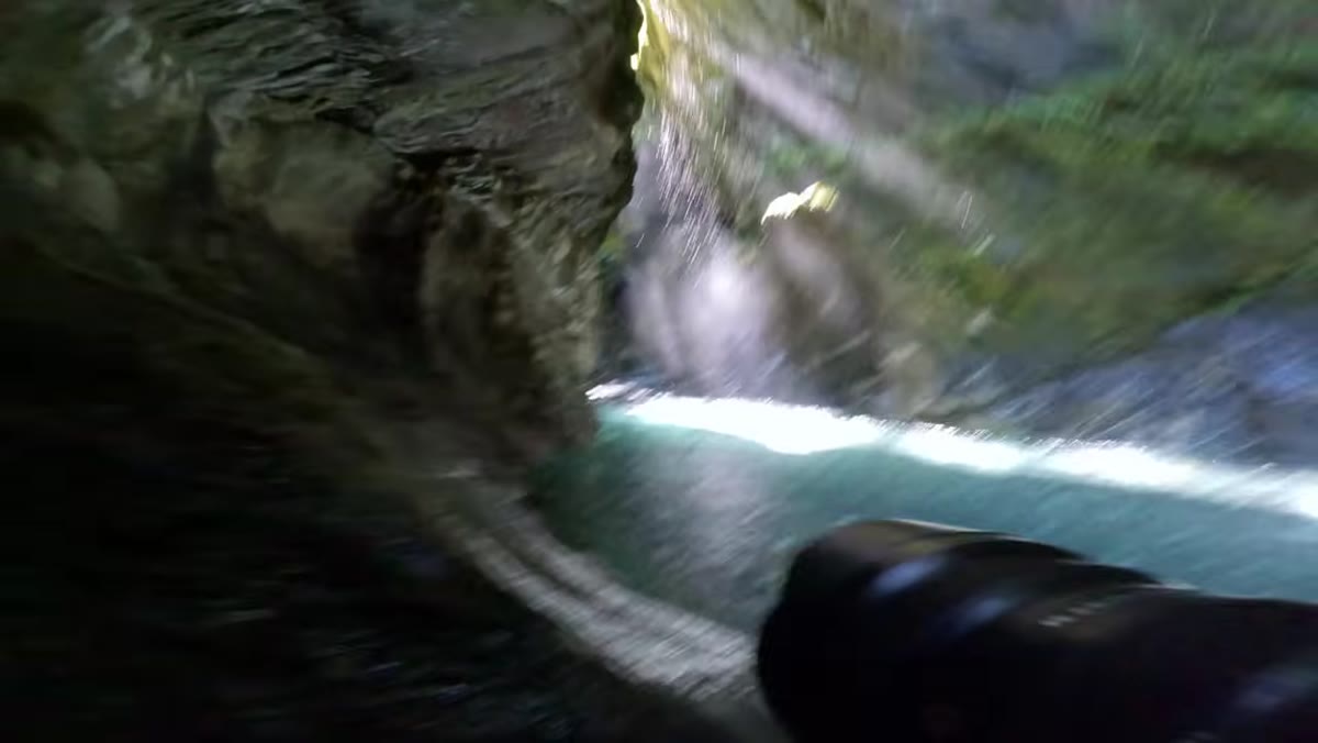 Ultra-wide 12mm composition showing rocks, reflections, and wide canyon opening