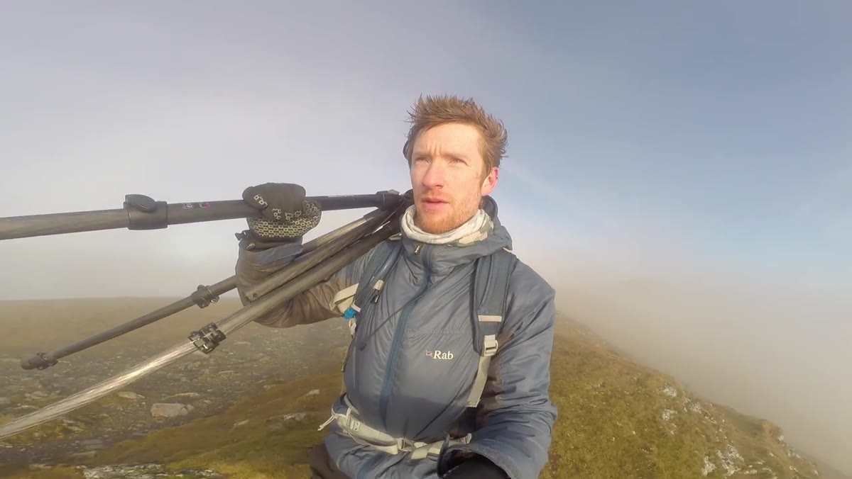 Heaton holding camera on shoulder, ready to shoot without tripod