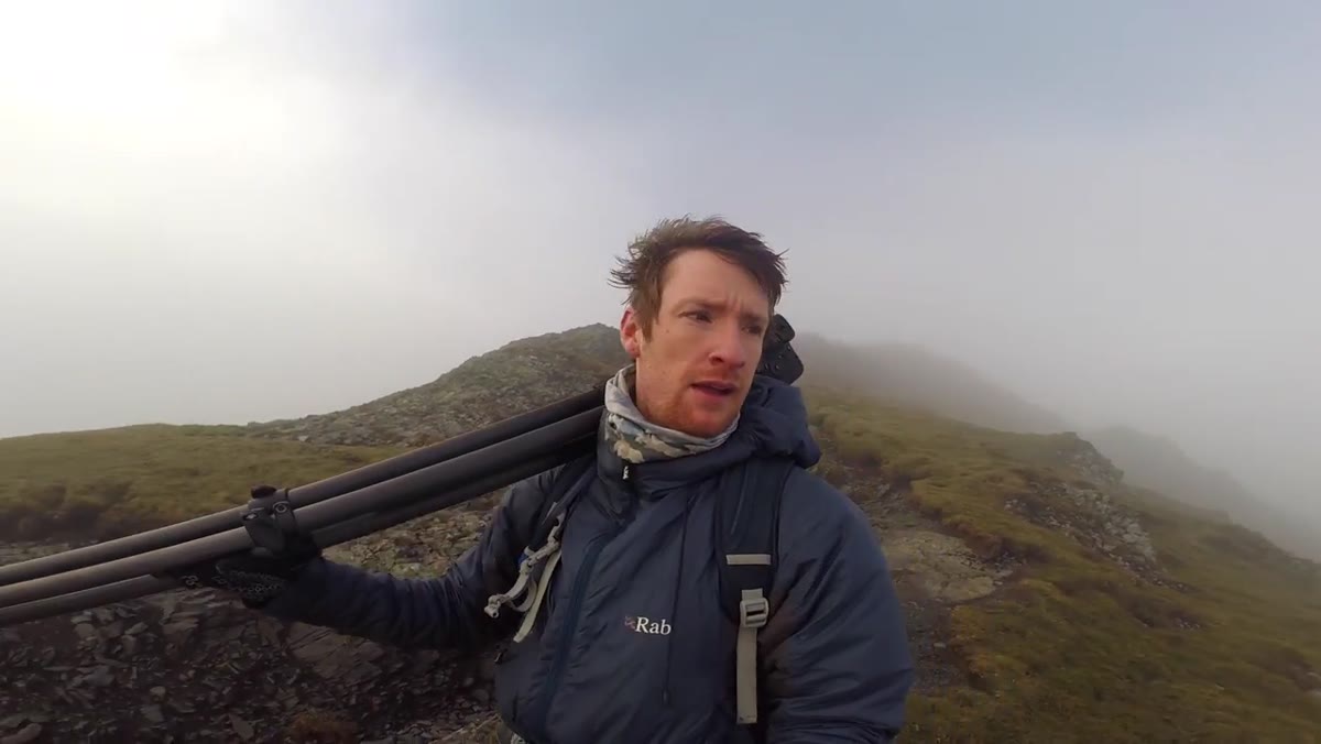 Heaton deciding to descend several hundred feet from the summit