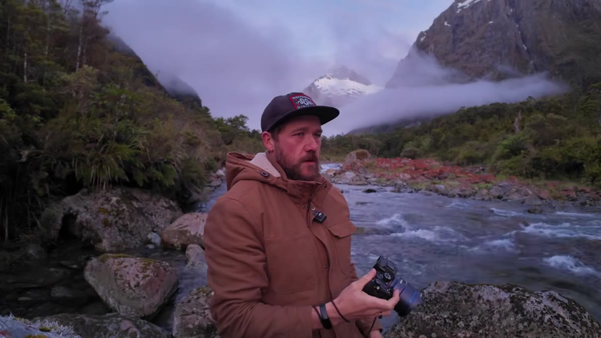 Camera settings displayed, slow shutter speed on moving river