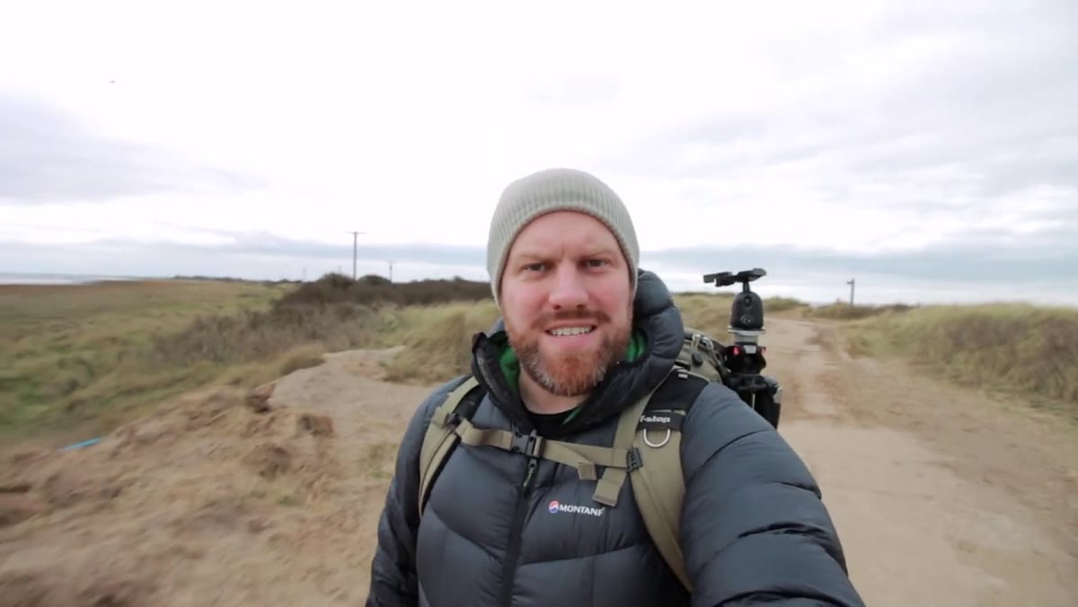 Walking toward the lighthouse along the Spurn Point shoreline