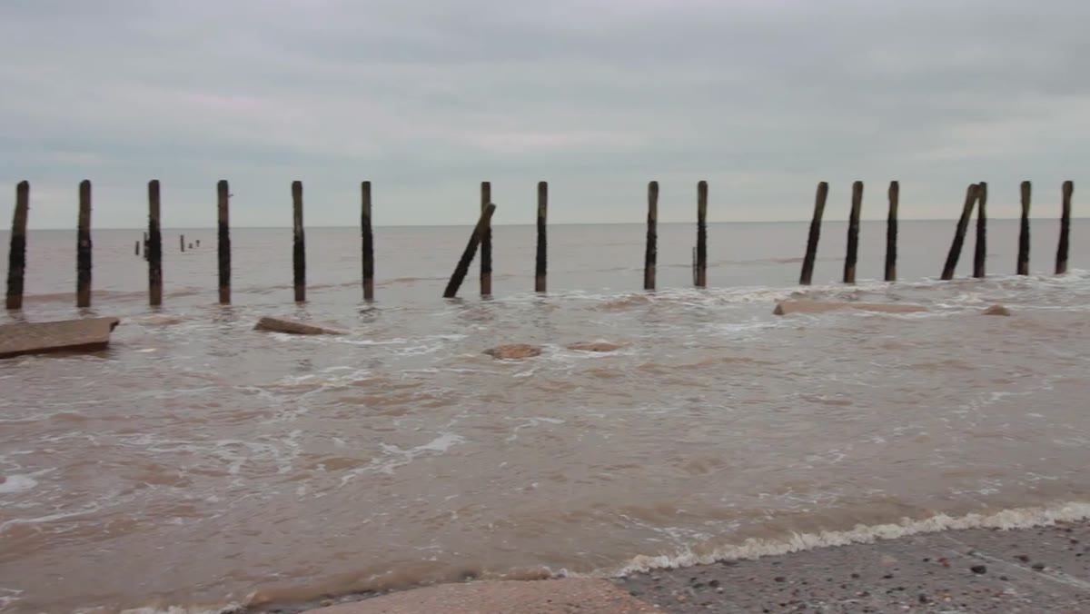 Camera set up on tripod for a long exposure over the sea