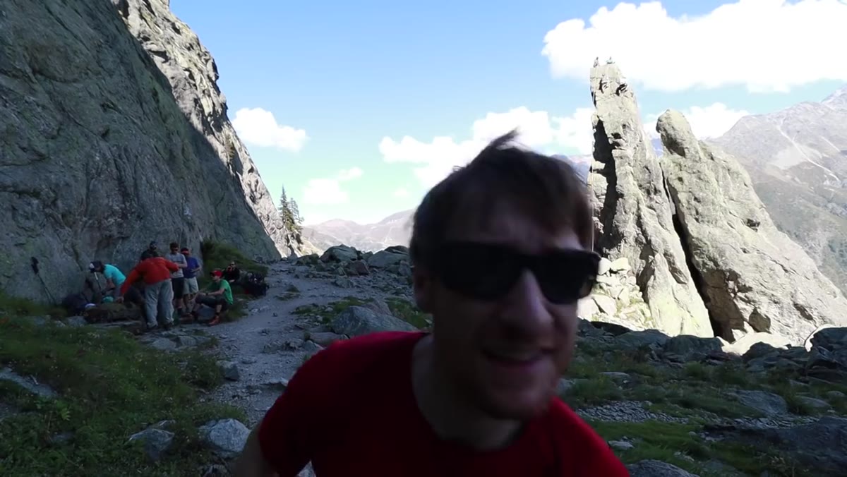 Group resting at halfway point with Mont Blanc visible in background