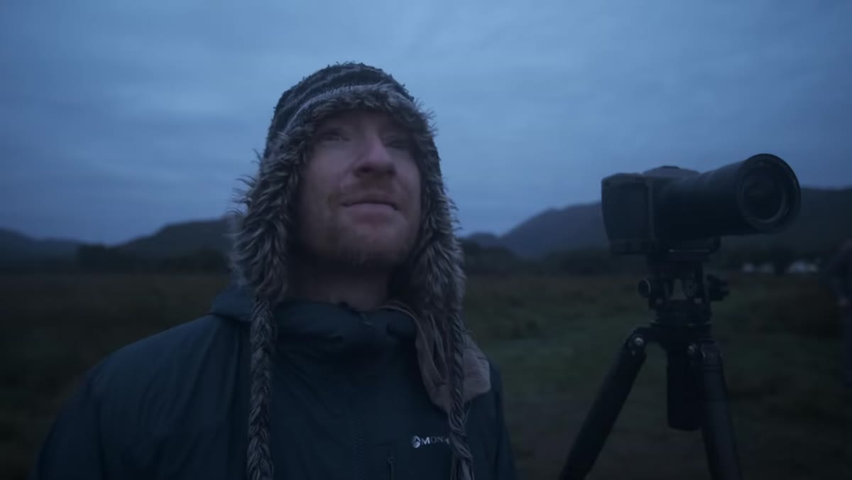 Thomas watching fading pre-sunrise glow on horizon