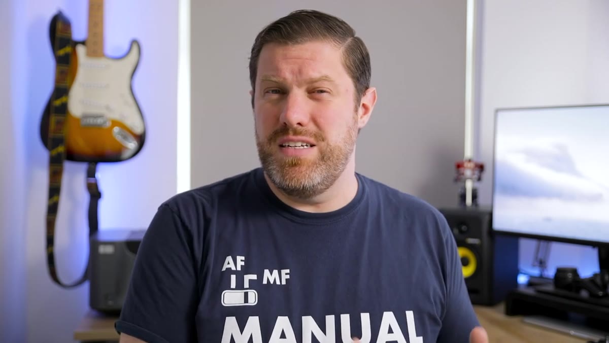 Creator reviewing disappointing images on camera screen in field