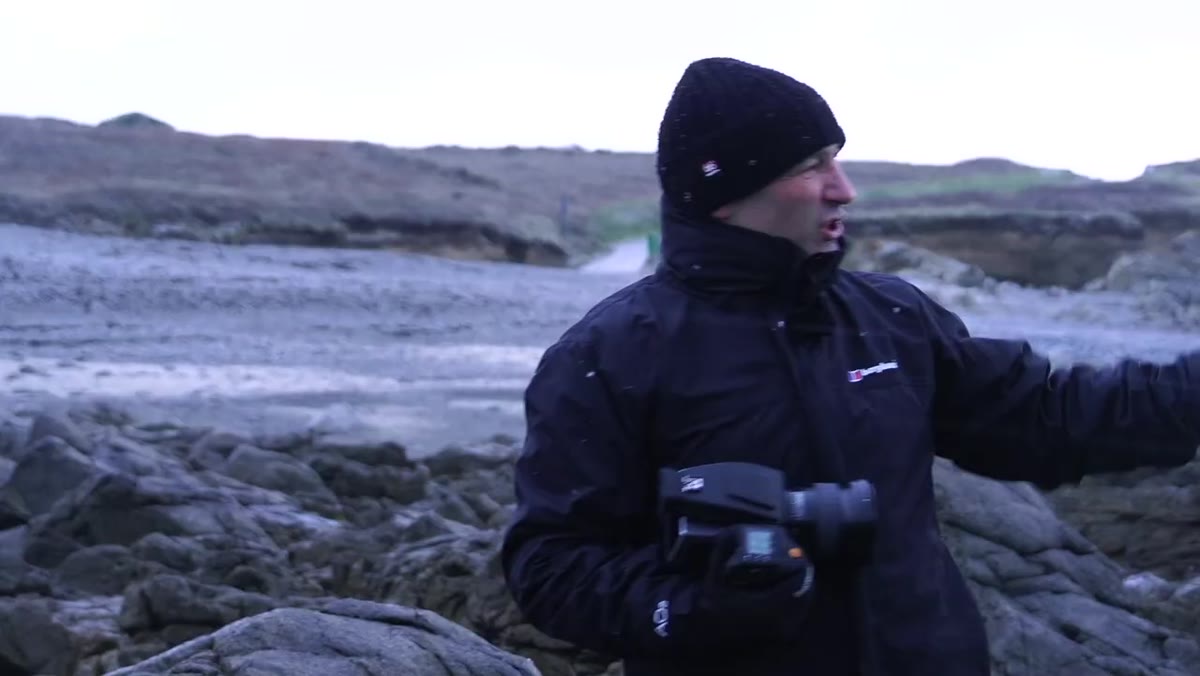 Photographer arriving at winter landscape location in heavy snowfall
