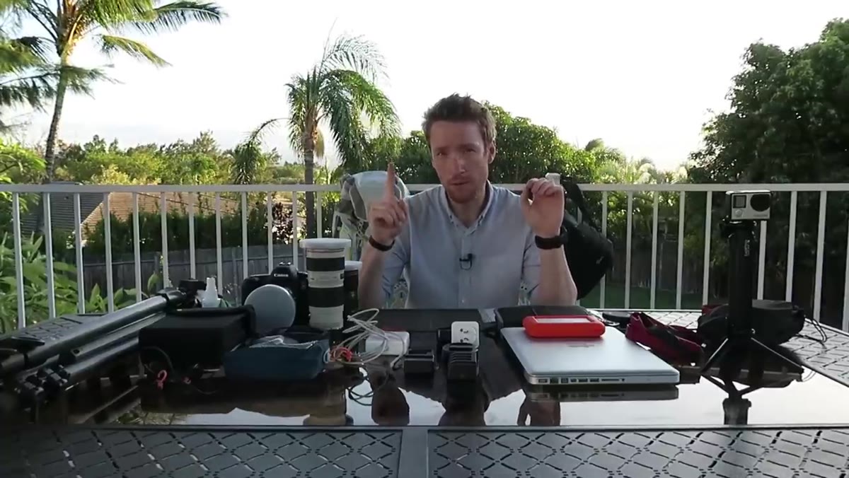 Thomas Heaton holding two different camera backpacks side by side