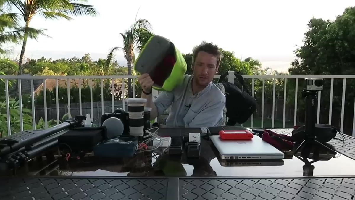 Heaton removing the internal camera insert from the backpack