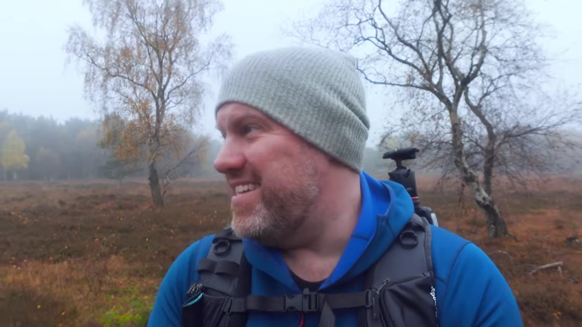 Misty trees visible behind Adam as he describes expectations