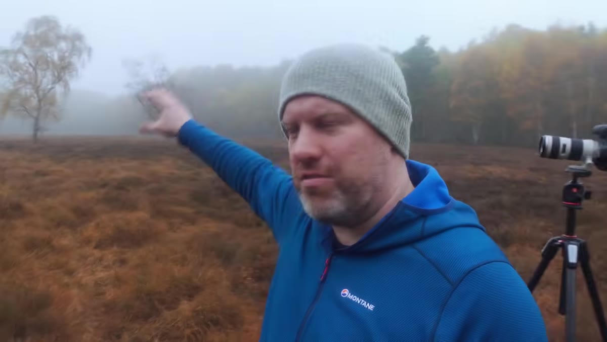 Adam sets up tripod for panorama across open moorland