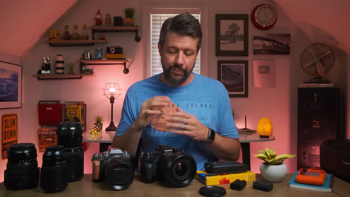 Photographer positioning camera low near water or ground level