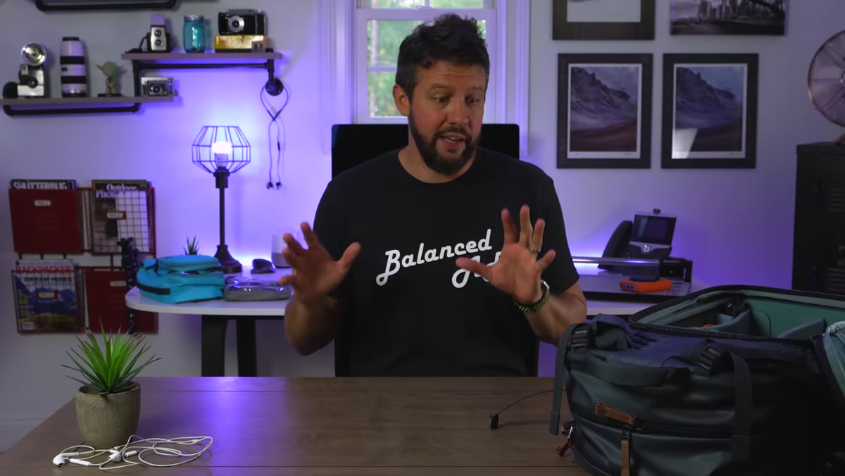 Mark Denney speaking at his desk about camera essentials