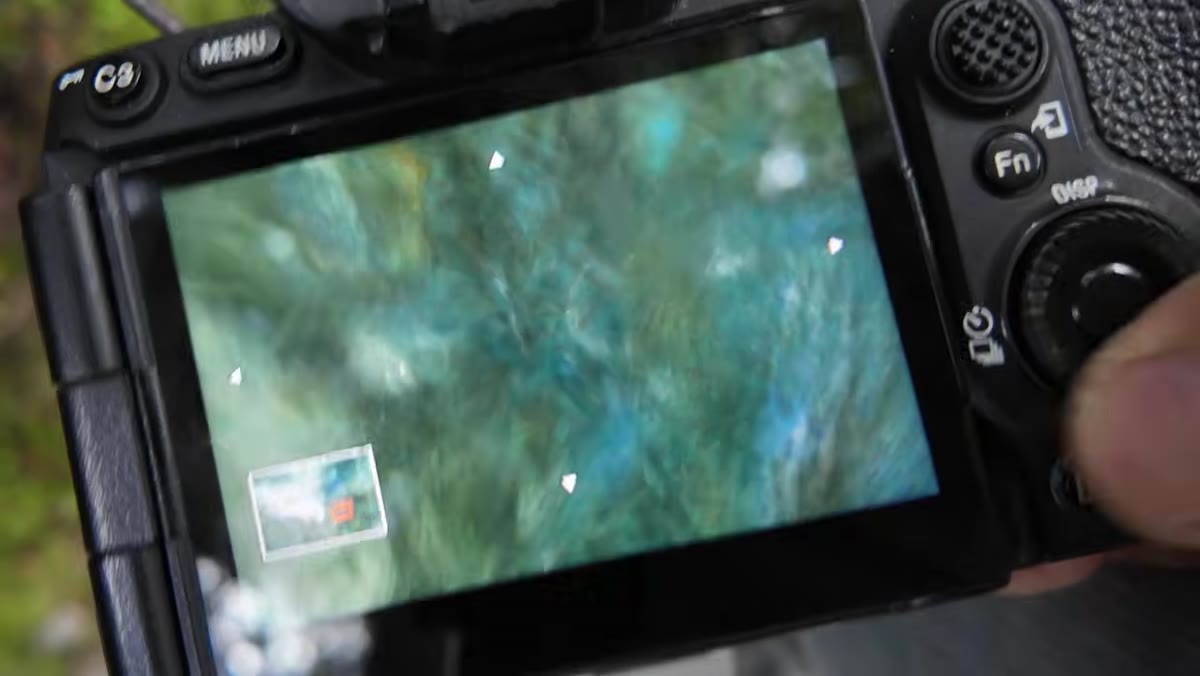 Patino shooting continuously at a fast-changing section of river