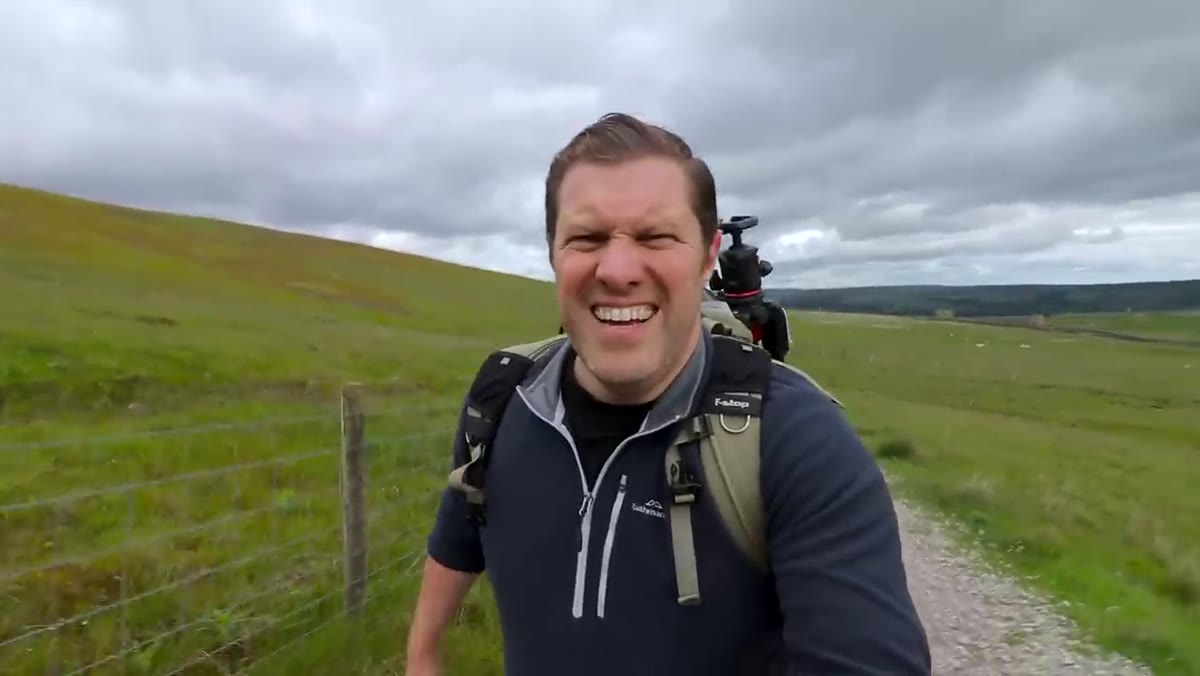 Host walking up hill toward Cold Stone Cut location
