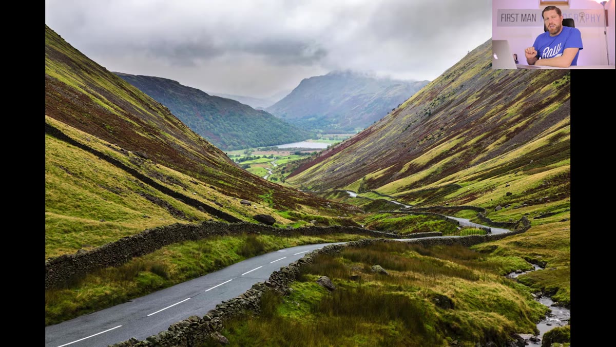 Road at Kirkstone Pass winding down toward valley and lake