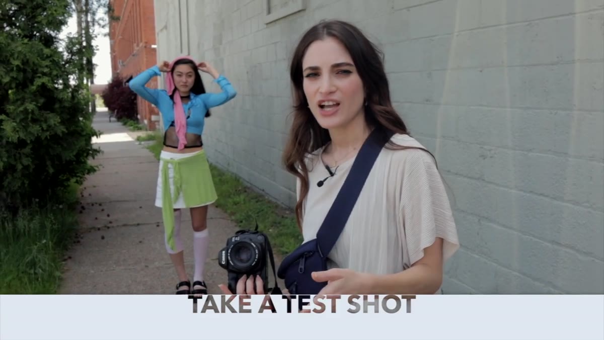 Photographer taking first test shot in outdoor location