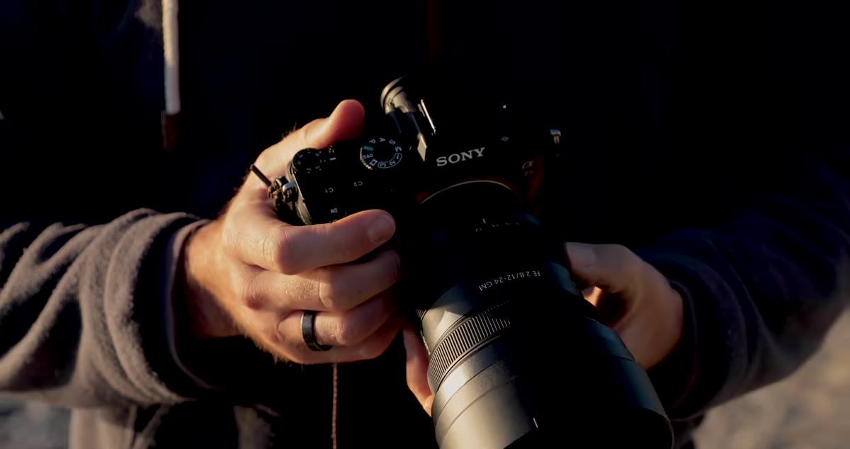 William showing three lenses covering 12mm to 400mm range
