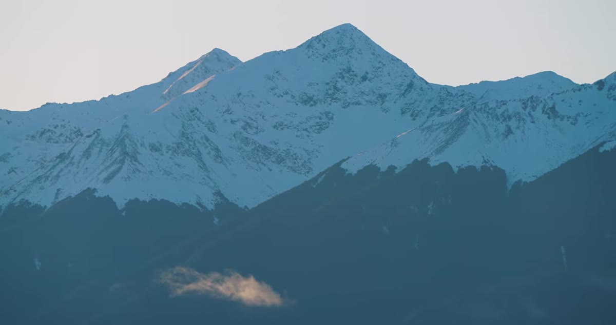 Telephoto framing isolating peak shape with minimal sky and foreground