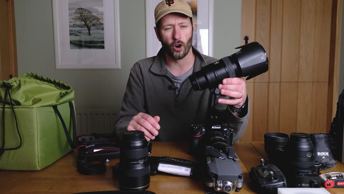 Nigel demonstrating the 70-200mm lens aimed at a distant landscape