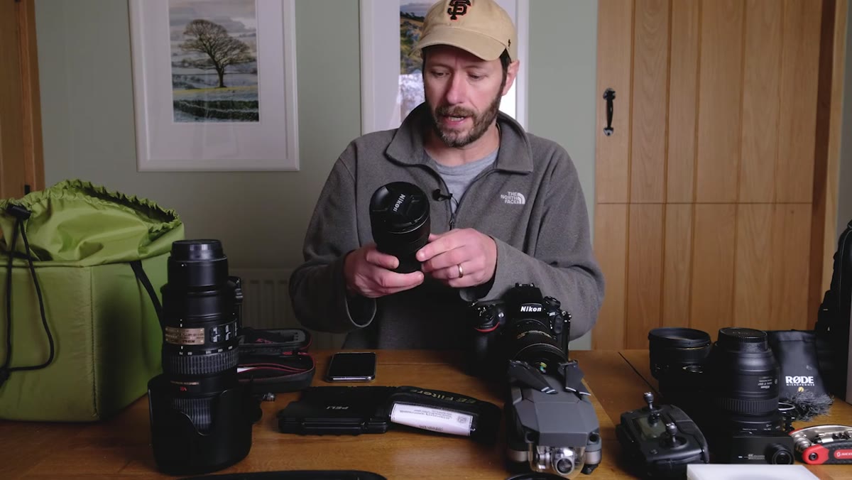 The 16-35mm wide-angle lens shown alongside other lenses in the kit