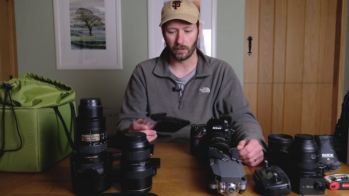Polarizing filter being rotated in front of the lens, showing effect on water