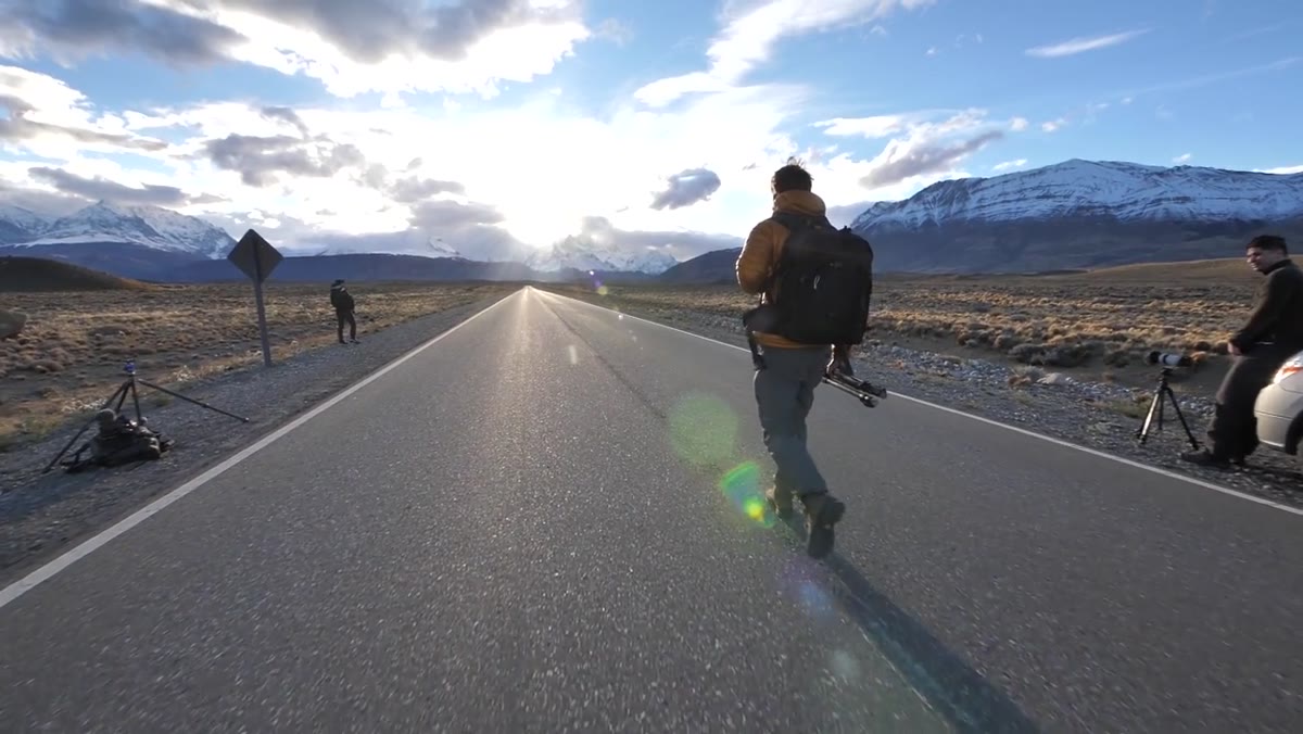 Heaton standing on the road evaluating Fitzroy at sunset