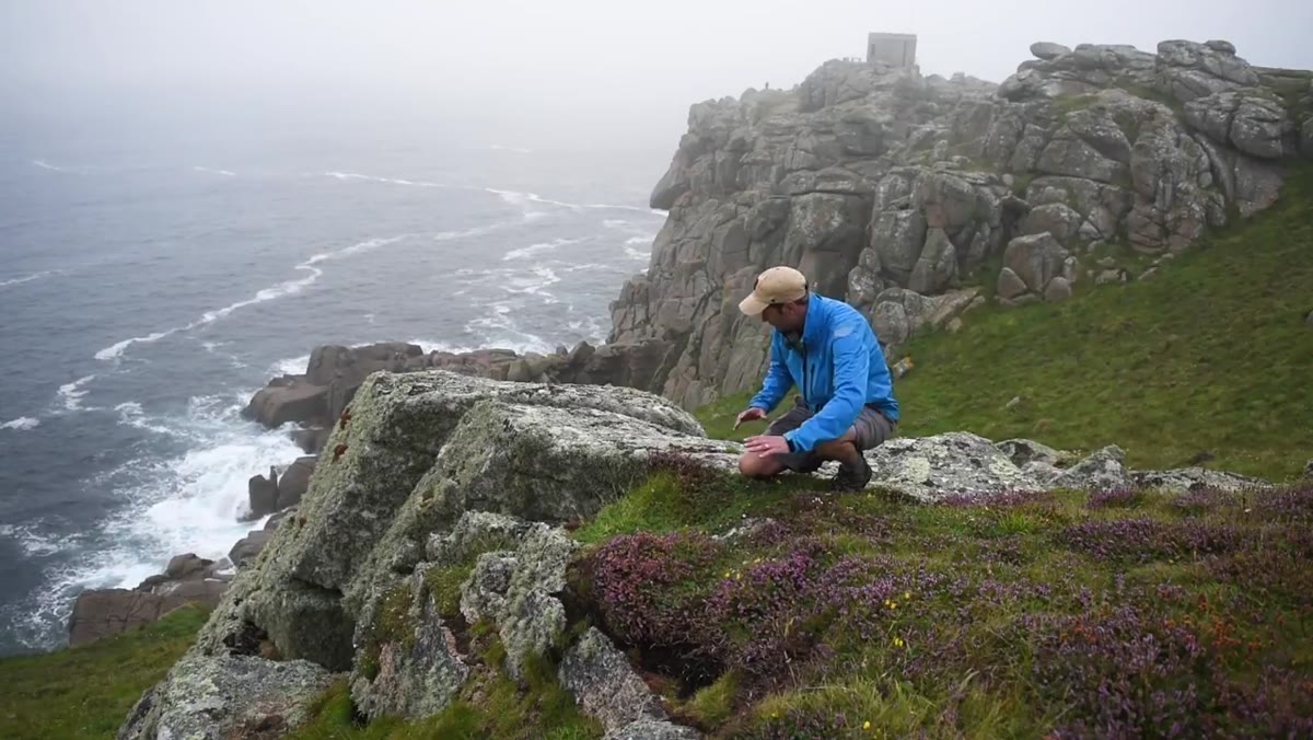 Danson pointing out how rocks and heather create visual pathways
