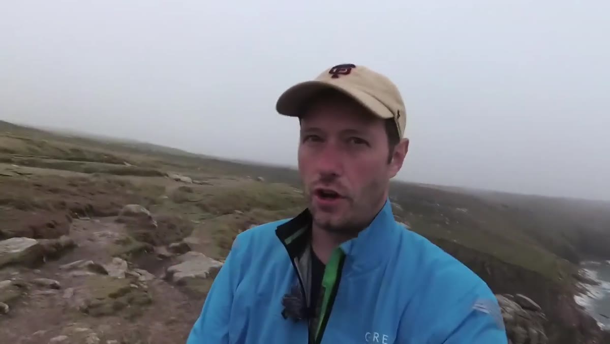 Danson raising tripod height for final composition in heavy mist