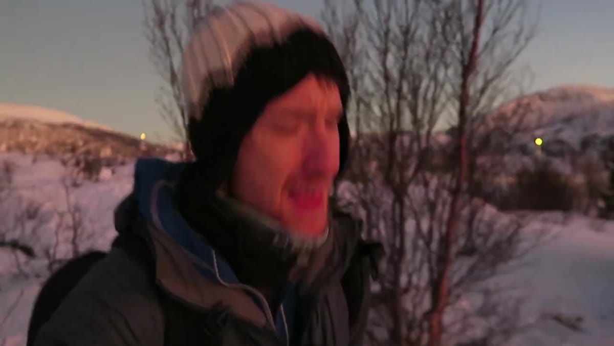 Heaton reacting to the unexpected post-sunset Arctic glow in the sky