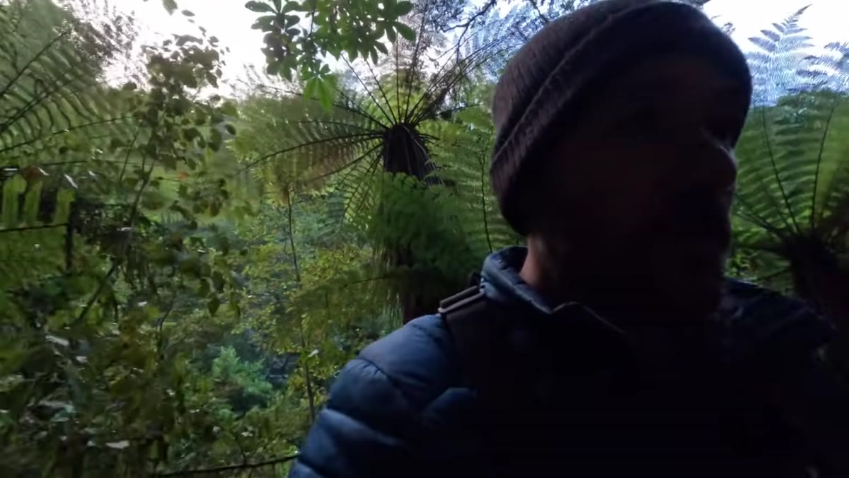 Patino exploring platforms above lower waterfall