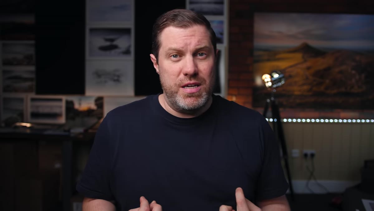 Adam speaking to camera about giving photographic prints as gifts