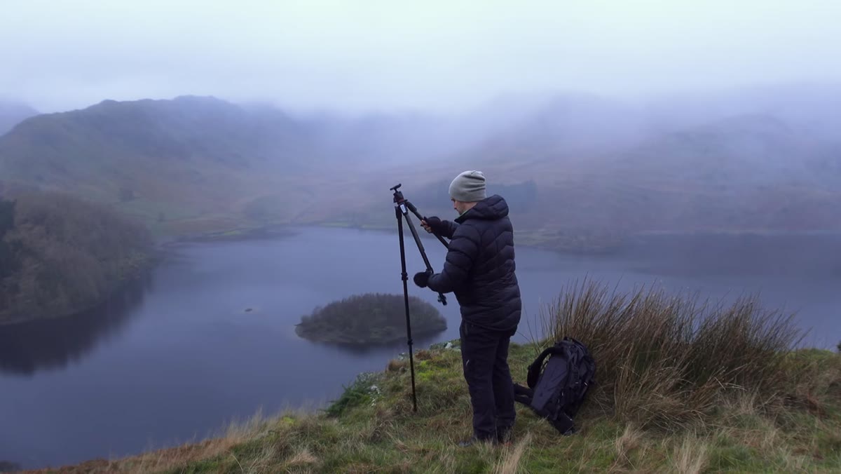 Wide valley view with low cloud base kissing mountain ridgelines