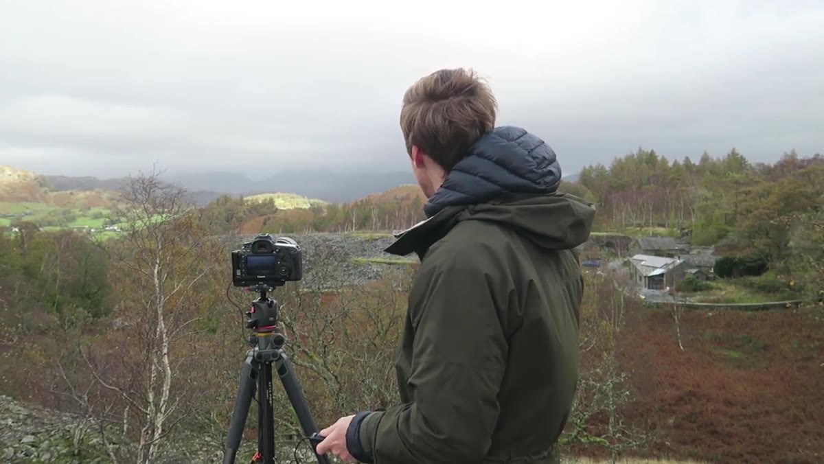 Thomas holding the remote shutter, watching the light sweep across the landscape