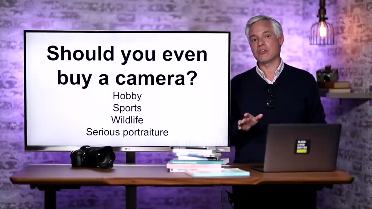 Tony gesturing while discussing smartphone camera quality