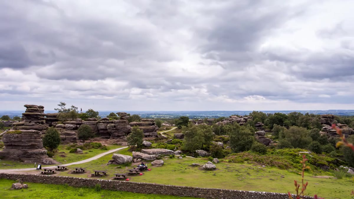 Busy scene at Brimham Rocks visitor area with crowds visible