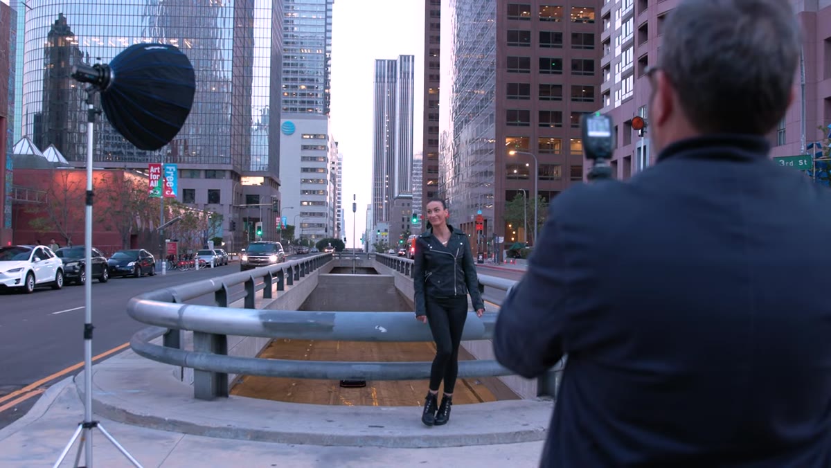 Jay shooting in blue hour conditions with city lights visible